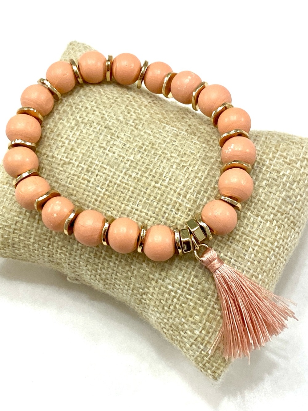 Peach Beaded Stretch Bracelet with Gold Accents and Tassel